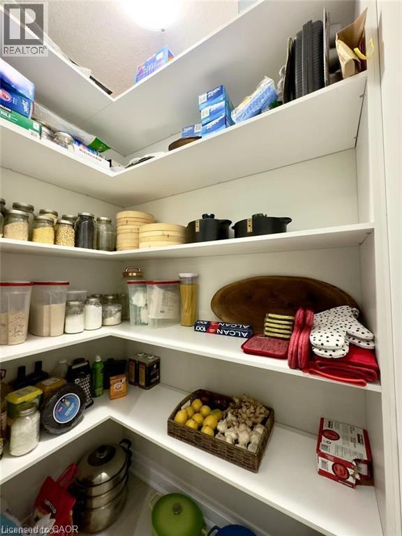 Built-in corner pantry with multiple white shelves - 923 Eaglecrest Court, Kitchener, ON