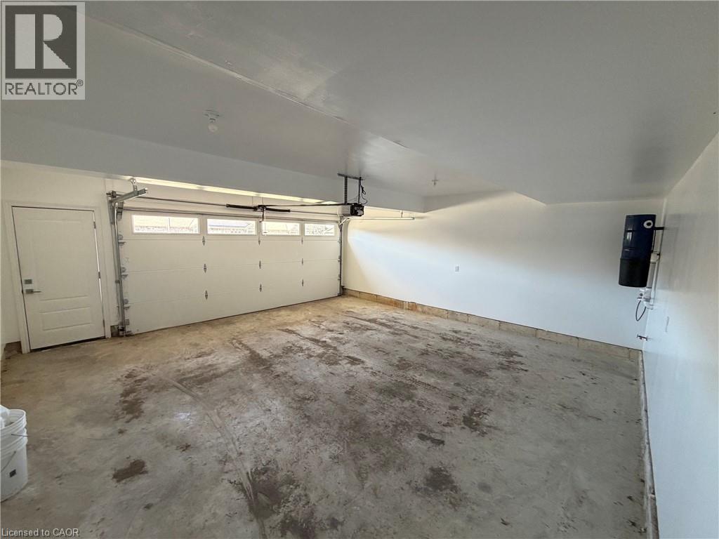 Double garage with person door, and direct access into the unit. - 9 Old Hamilton Road Unit# 2, Port Dover, ON