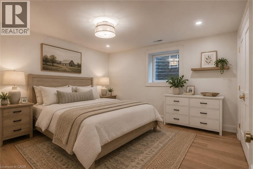 Well-appointed room featuring wood-finish flooring, a neutral color palette, recessed lighting, a window, and a built-in shelf - 130 Edgecliffe Place, Halton, ON