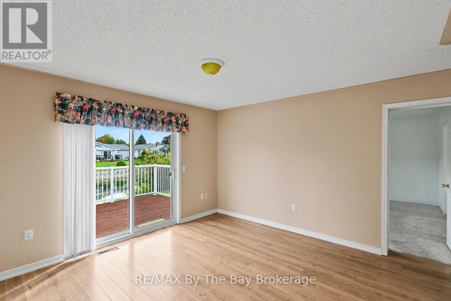2nd bedroom with Patio Doors to the Back Deck - 30 St James Place, Wasaga Beach, ON