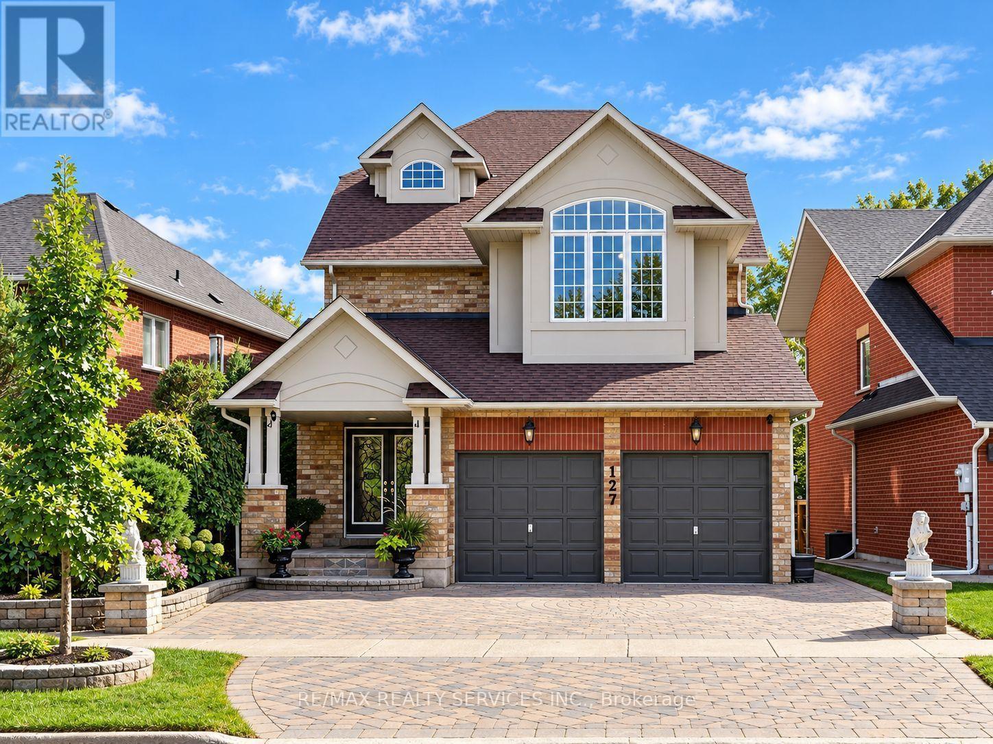 Large driveway with two-car garage - 127 Russell Jarvis Drive, Markham, ON