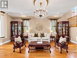 Living room with smooth ceilings and pot lights -