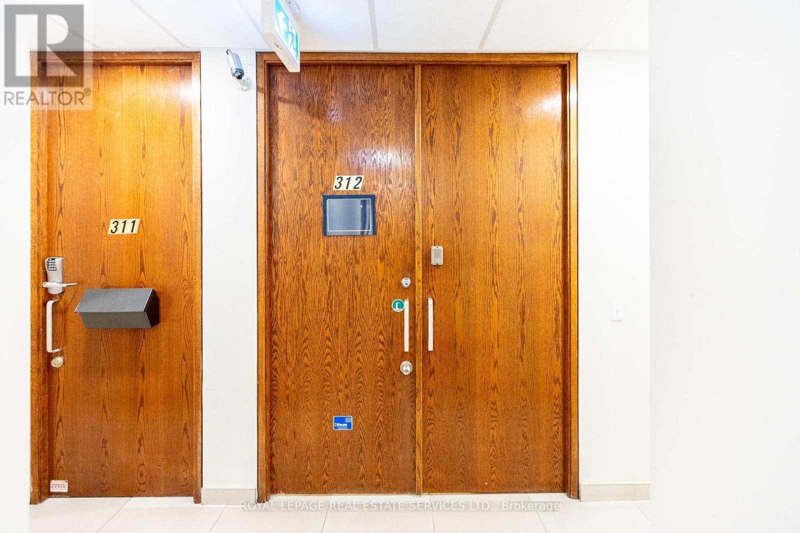 Door with an intercom and safety features - 312 - 7368 Yonge Street, Vaughan, ON