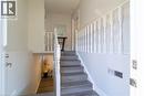 Staircase with wood-finish treads and white balusters - 137 Nickolas Crescent, Cambridge, ON 
