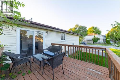 Wood-finish decking with a wood railing system and siding exterior - 137 Nickolas Crescent, Cambridge, ON 