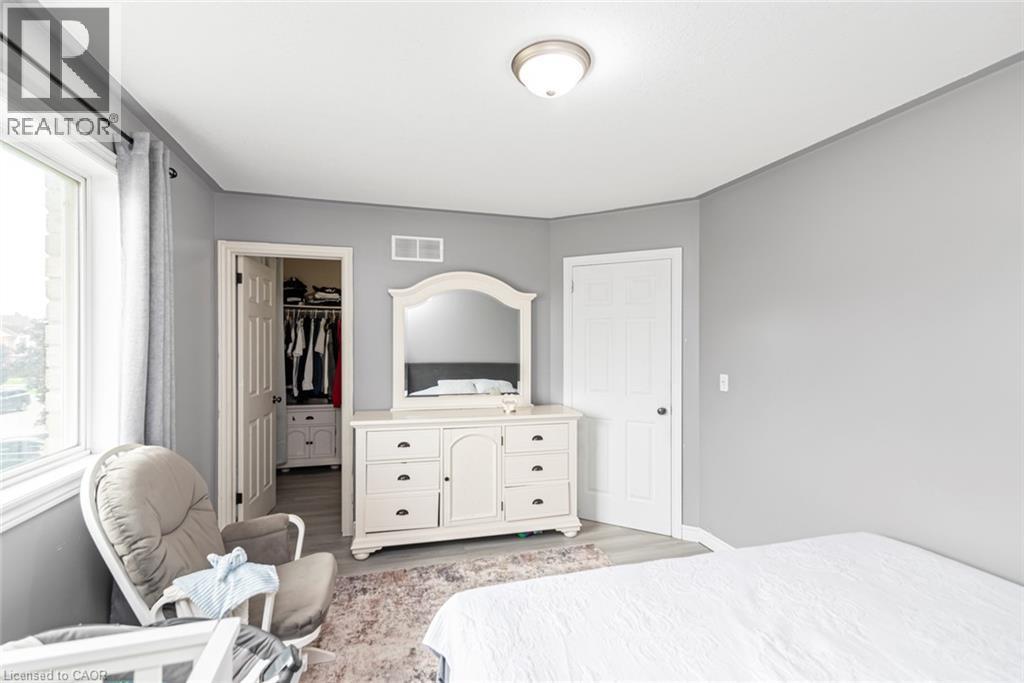 Recessed window, white trim, light gray walls, wood-finish flooring, ceiling-mounted light fixture - 42 Saturn Road, Port Colborne, ON