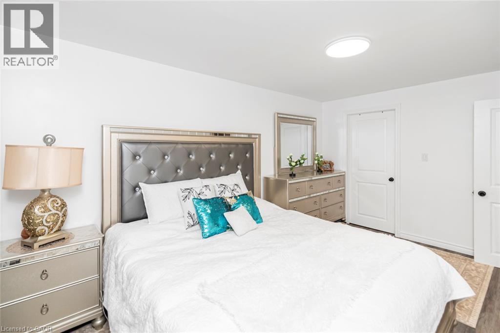 White walls with a flush-mount ceiling light - 42 Saturn Road, Port Colborne, ON