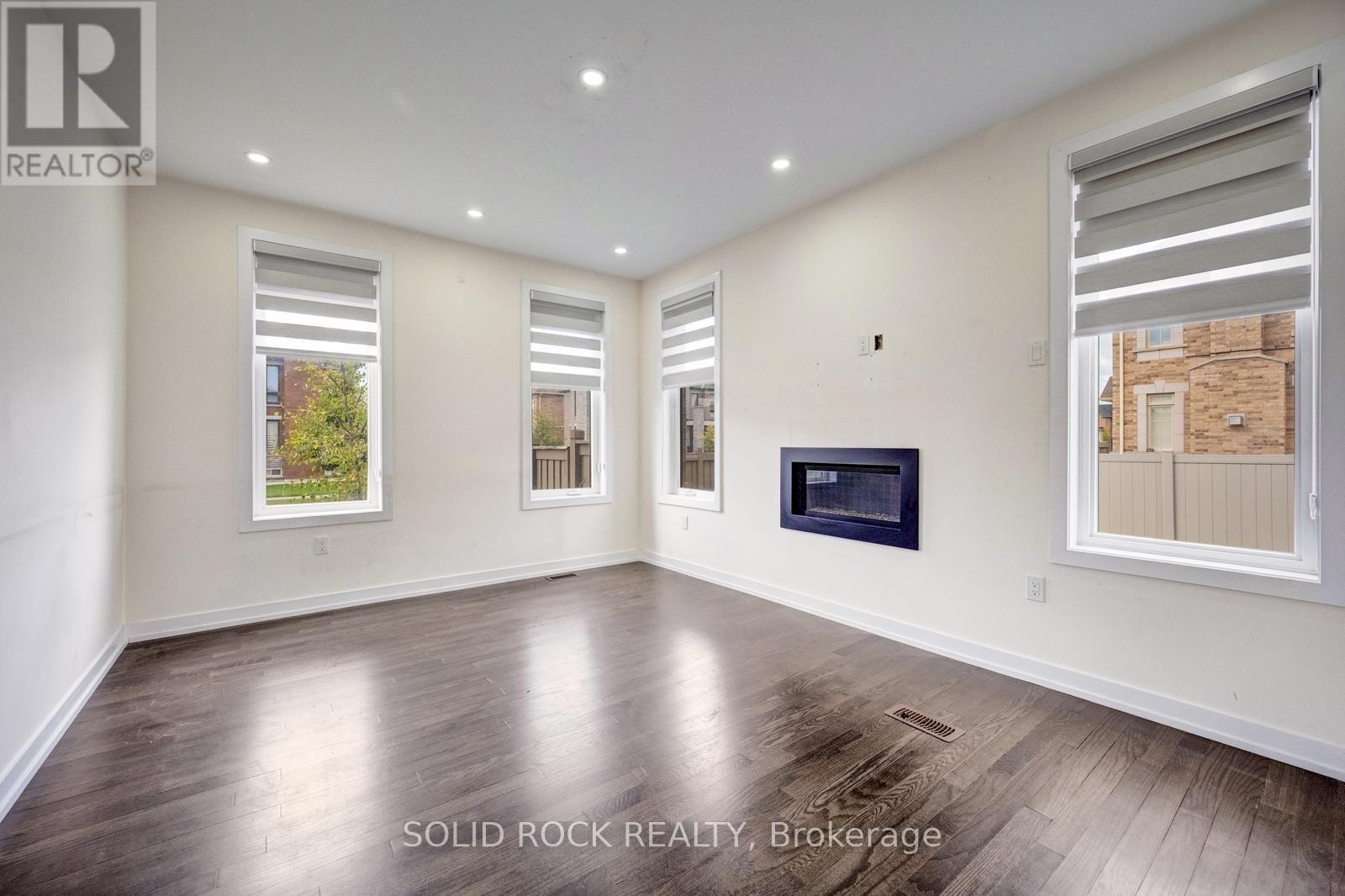 Family Room with Gas Fireplace - 93 Parity Road, Brampton, ON