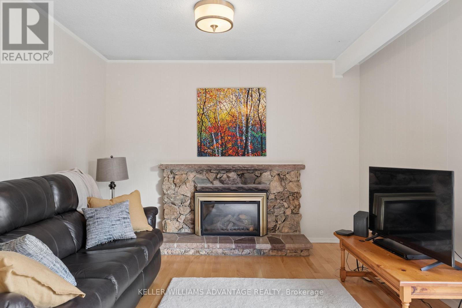 Family room has gas fireplace - 128 Holmcrest Trail, Toronto, ON
