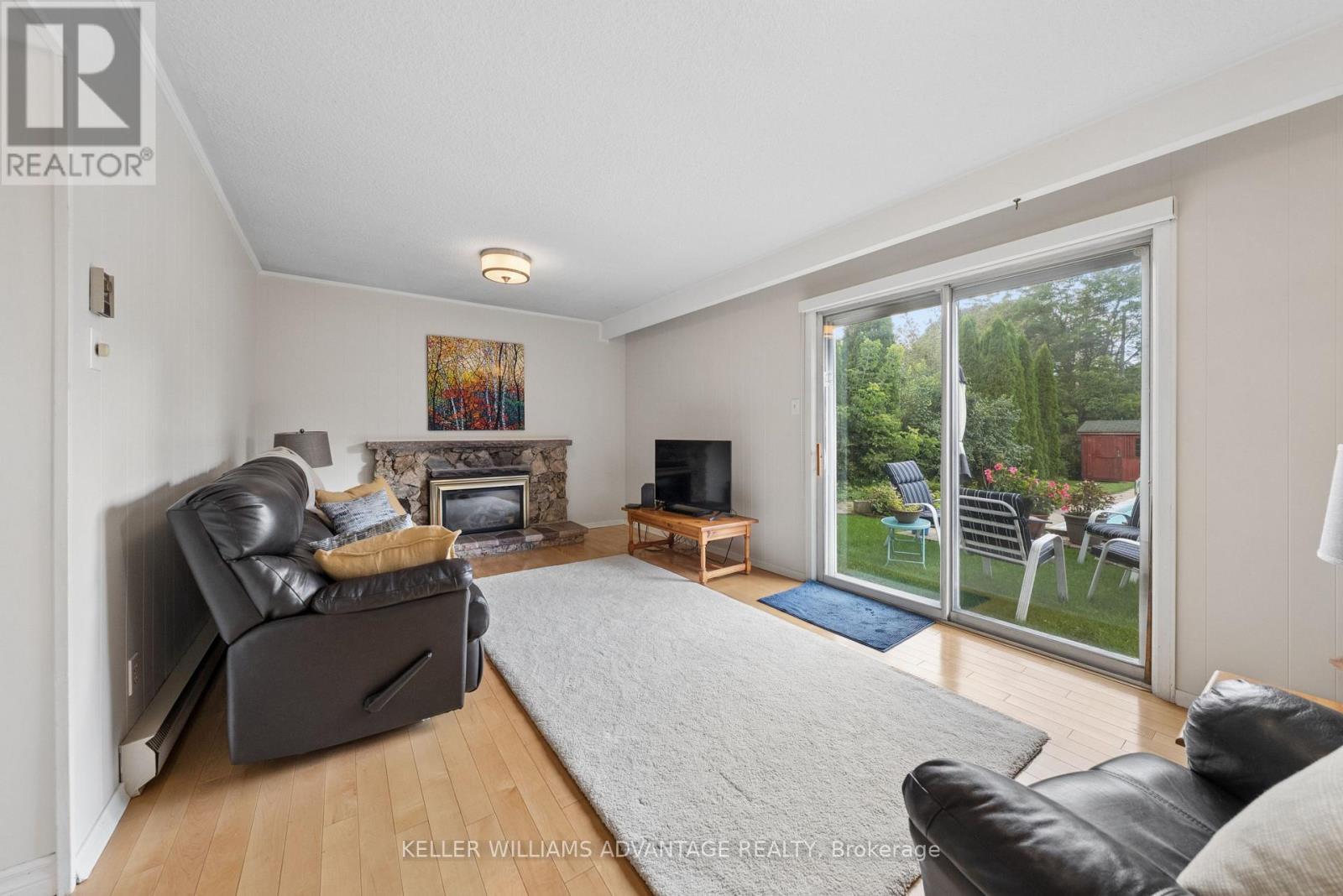 Family room walk out to pool & yard - 128 Holmcrest Trail, Toronto, ON