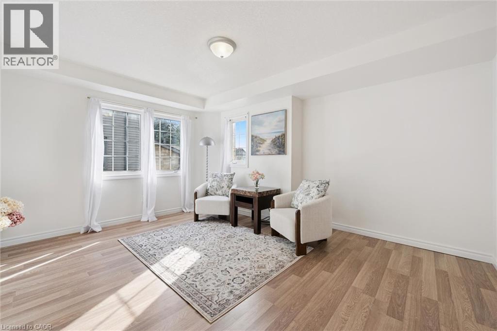 Recessed lighting, wood-finish flooring, white walls, and multiple windows - 931 Glasgow Street Unit# 27B, Kitchener, ON