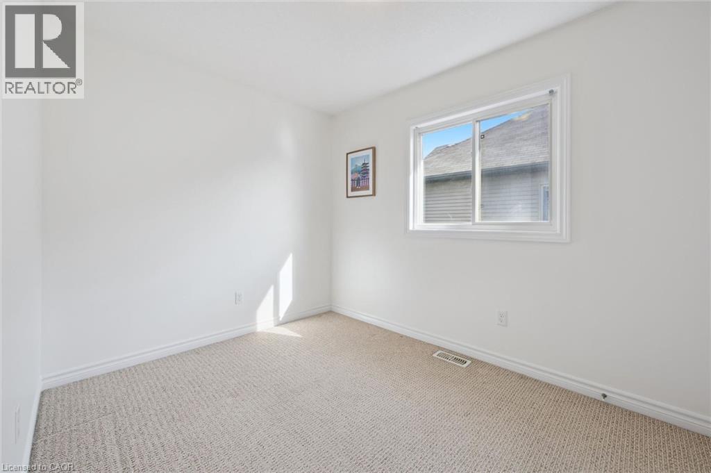 Bright white walls with light-toned carpeting - 931 Glasgow Street Unit# 27B, Kitchener, ON