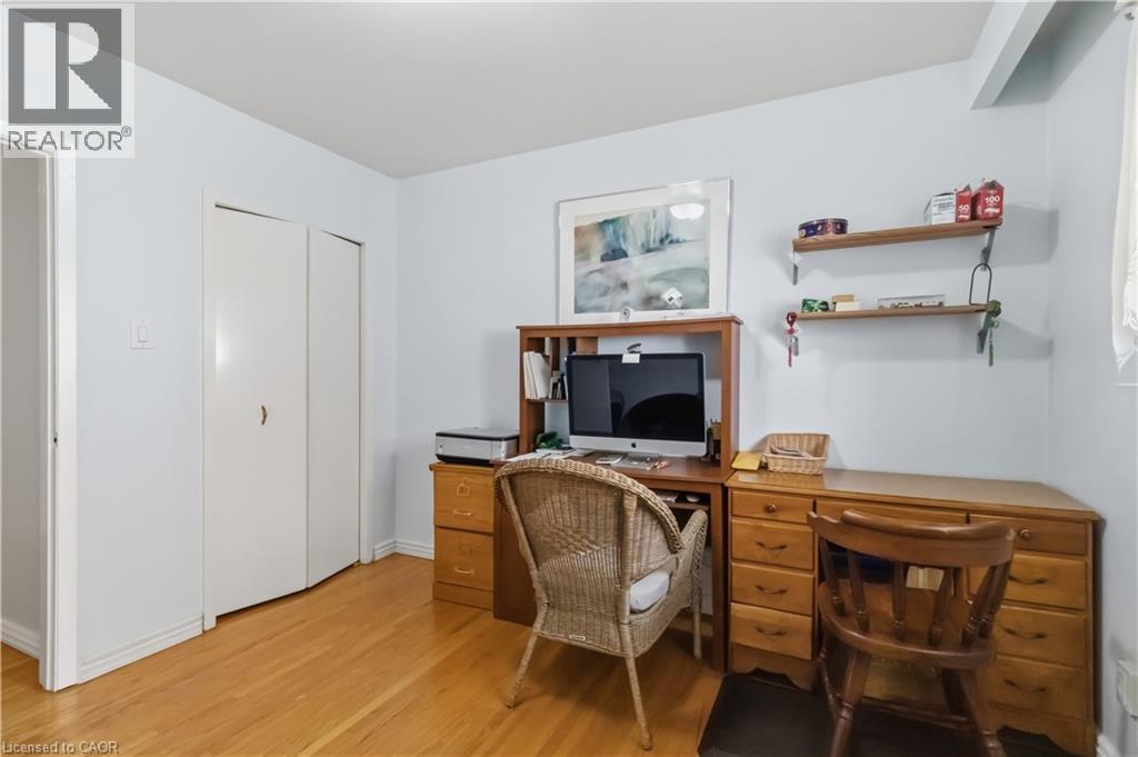 Wood-finish flooring, light-toned wall paint, and a built-in double-door closet - 152 Hilda Avenue, North York, ON