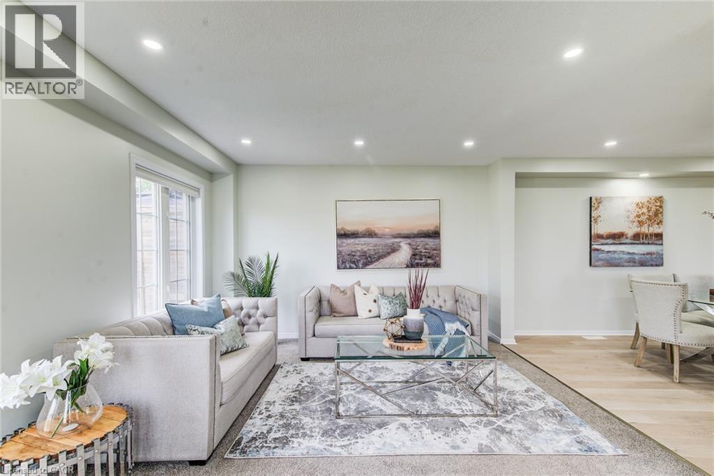 Recessed lighting illuminates the space, featuring window with ample natural light, and wood-finish flooring - 226 Maitland Street, Kitchener, ON