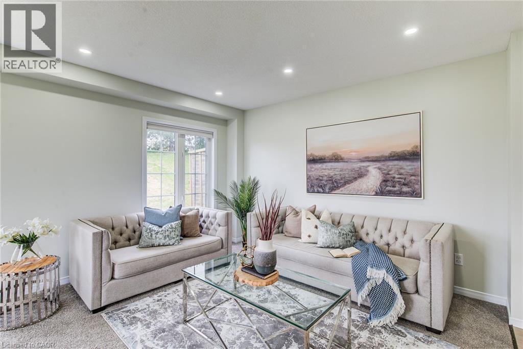 Recessed ceiling lighting, light-colored walls, window with gridded pane, and carpeted flooring - 226 Maitland Street, Kitchener, ON