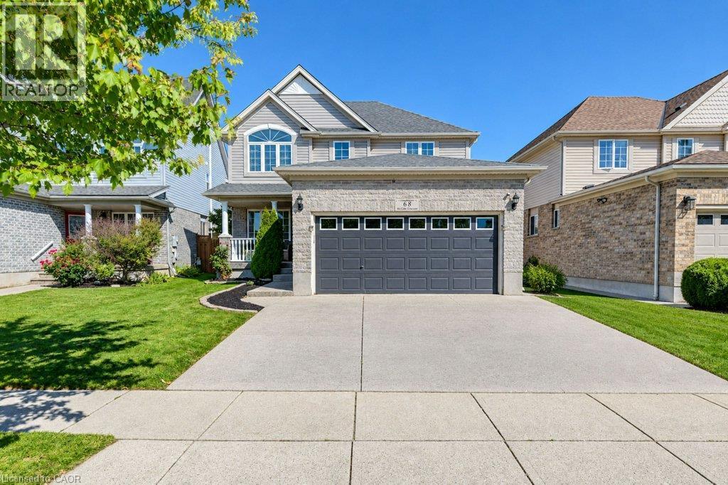 Two-story residence featuring a combination of brick and siding, an attached two-car garage, concrete driveway, and a front porch - 88 Decaro Crescent, Cambridge, ON