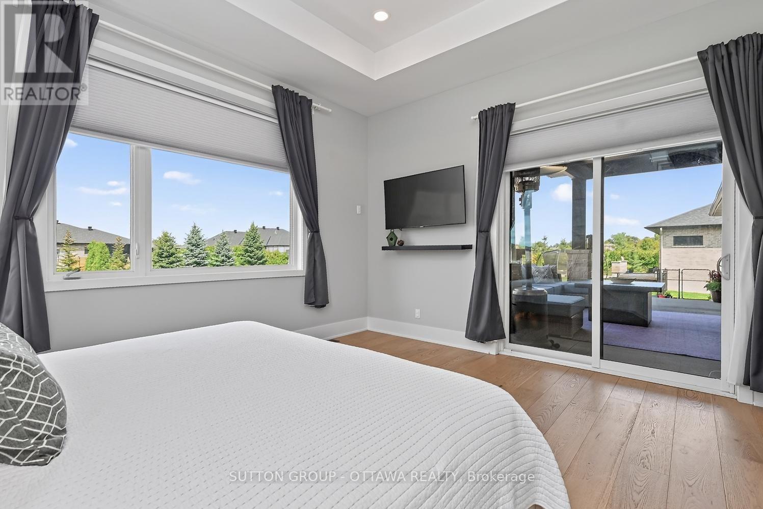 Primary Bed with covered Patio Access - 7095 Still Meadow Way, Ottawa, ON