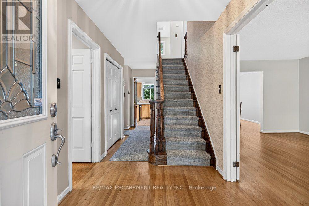Front entryway showing the runner up the stairs - 159 All Saints Crescent, Oakville, ON