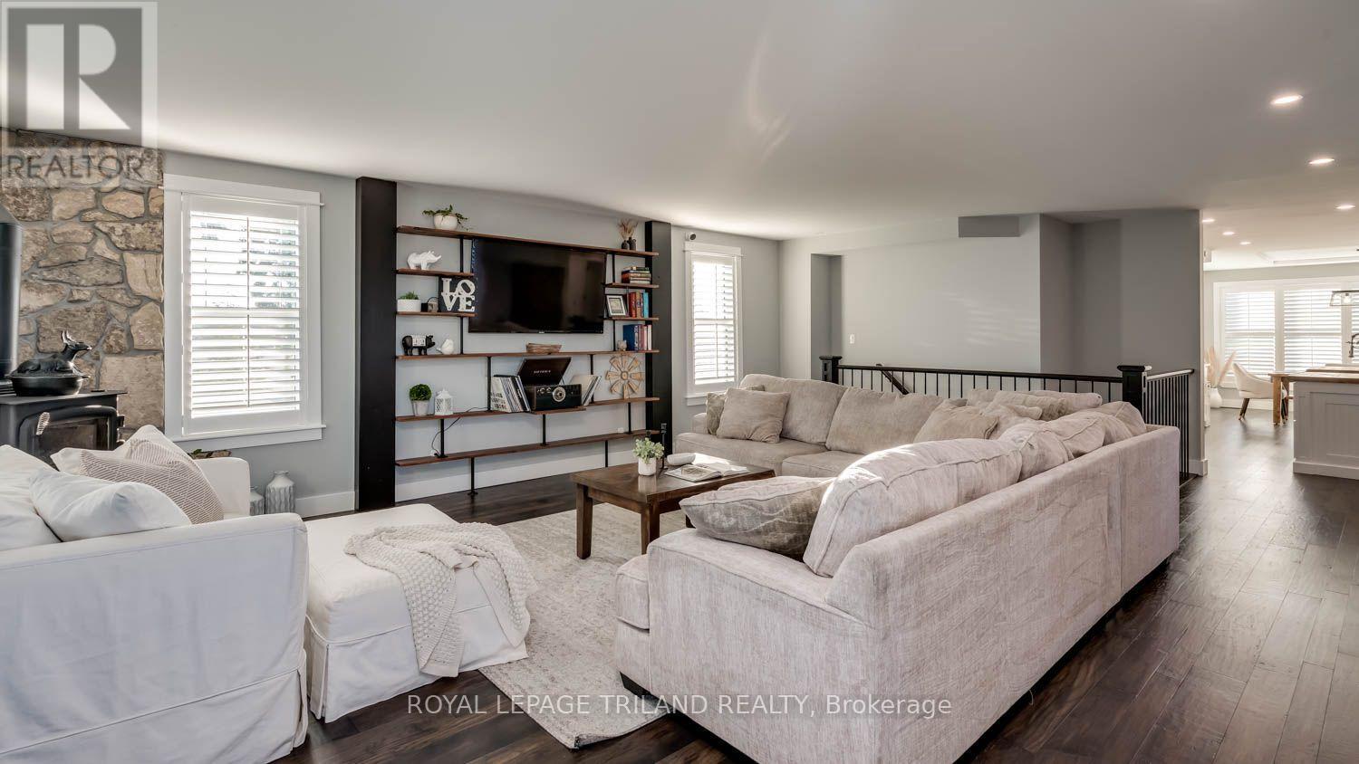 Living room with a wood burning stove - 11688 Charlton Drive, Middlesex Centre, ON