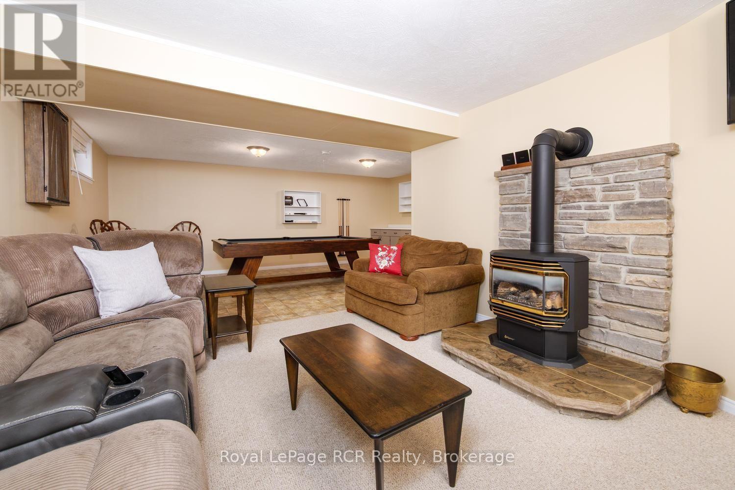 Rec room with gas fireplace - 84040 Sideroad 6 Road, Meaford, ON