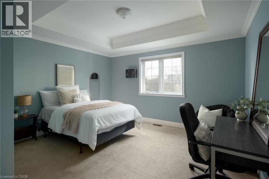 Tray ceiling with crown molding, carpeted flooring, and a large window with white trim - 1505 Milburough Line, Carlisle, ON