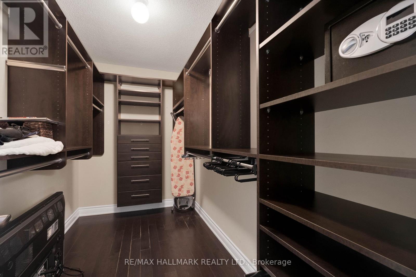 Primary bedroom walk in closet - 3458 Skipton Lane, Oakville, ON