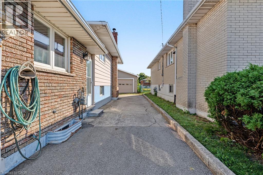 LOADS OF PARKING!! YOU see it correctly 8+ cars will fit easily!! - 589 Mohawk Road W, Hamilton, ON