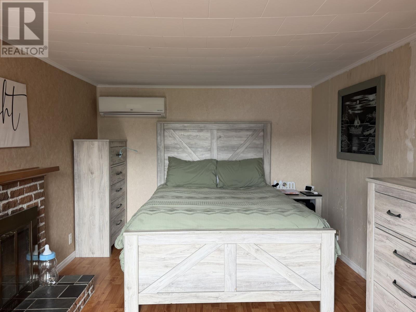 living room, currently being used as a bedroom - 3 Banting Street, Musgrave Harbour, NL