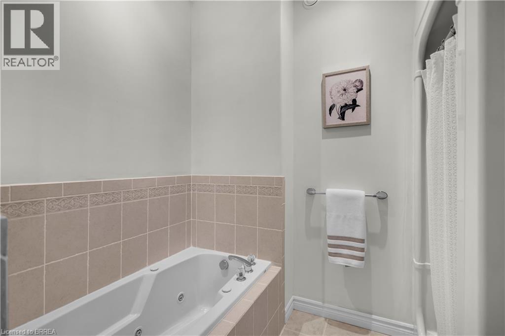 Jetted bathtub with chrome fixtures - 302 German School Road, Paris, ON