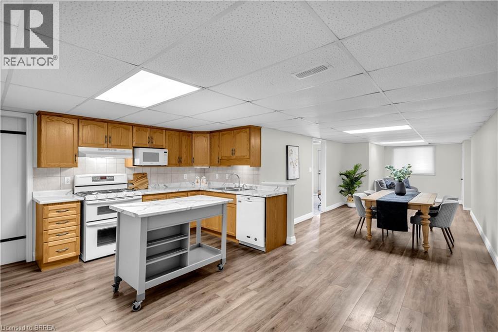 Open-concept living area featuring wood-finish flooring - 302 German School Road, Paris, ON