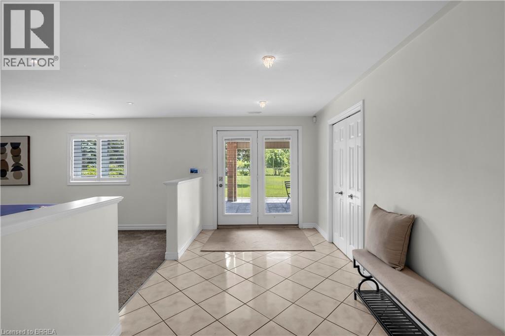 Tiled flooring entry with direct outdoor access via double glass doors - 302 German School Road, Paris, ON