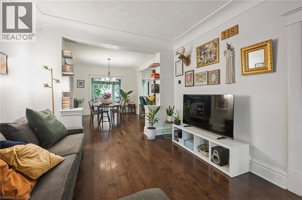 Hardwood flooring, recessed archway, and cove ceiling - 58 Balmoral Avenue N, Hamilton, ON