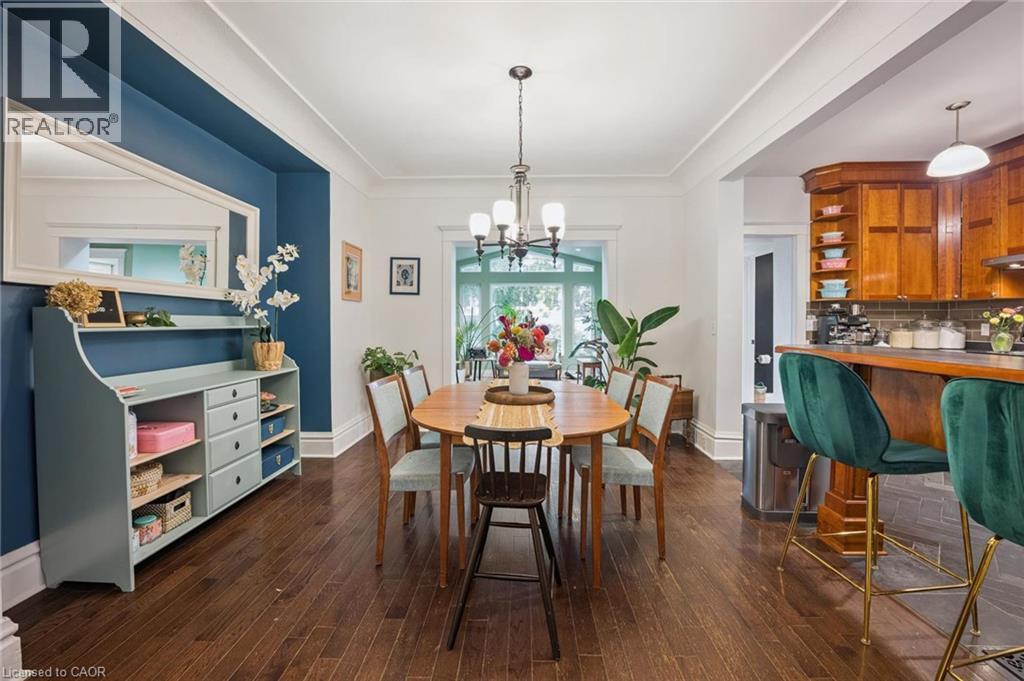 Hardwood flooring, recessed archway, and cove ceiling - 58 Balmoral Avenue N, Hamilton, ON