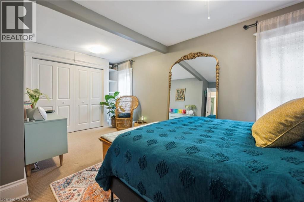 Double bi-fold closet doors, built-in shelving - 58 Balmoral Avenue N, Hamilton, ON