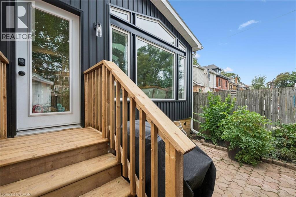 Wood decking, and a full-light entry door - 58 Balmoral Avenue N, Hamilton, ON