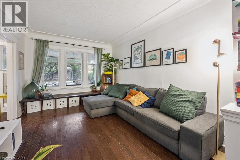 Hardwood flooring, window bench, and cove ceiling - 58 Balmoral Avenue N, Hamilton, ON
