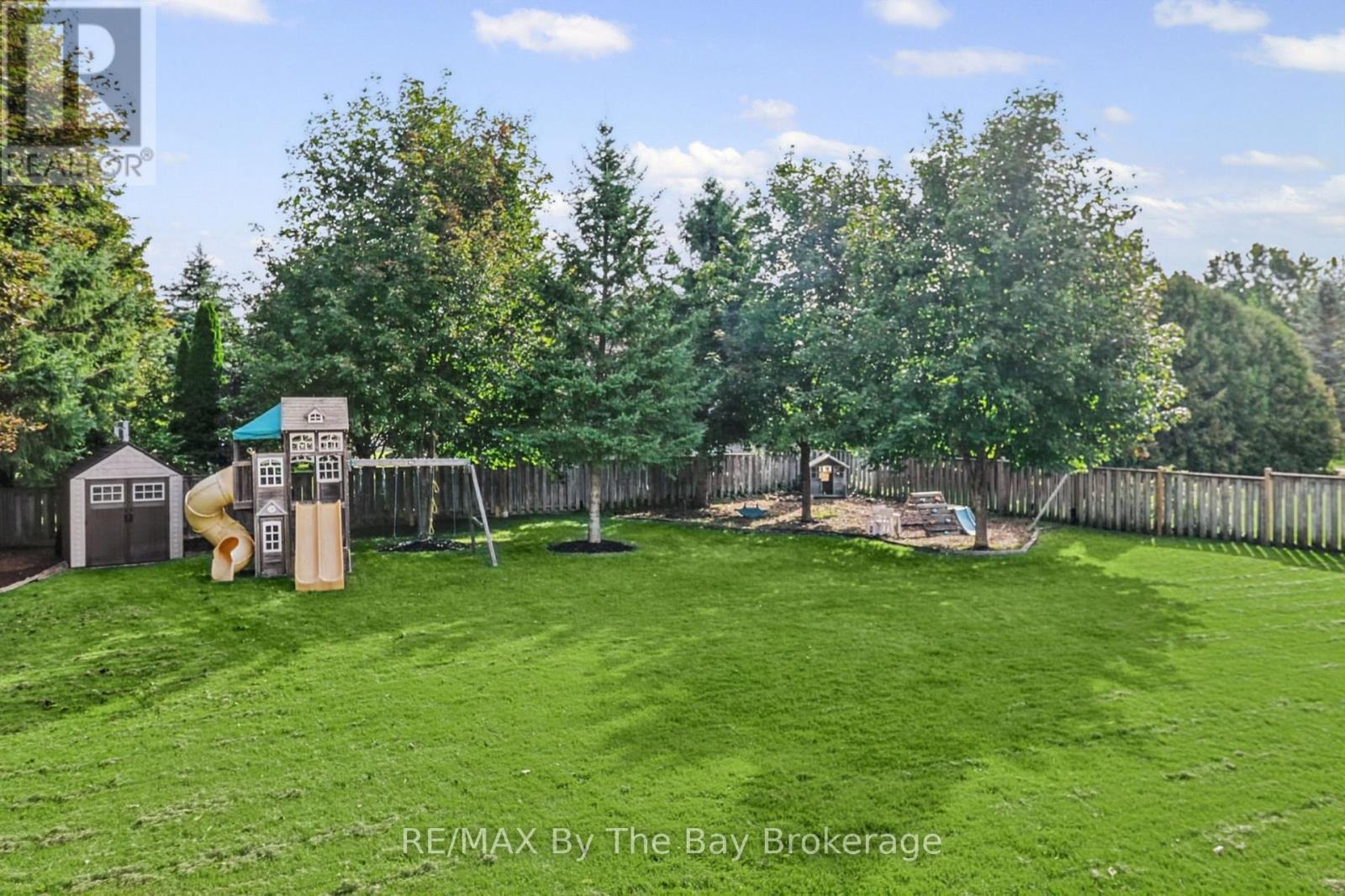 Large Fenced Backyard with In- Ground Sprinklers - 2 Red Oak Drive, Wasaga Beach, ON