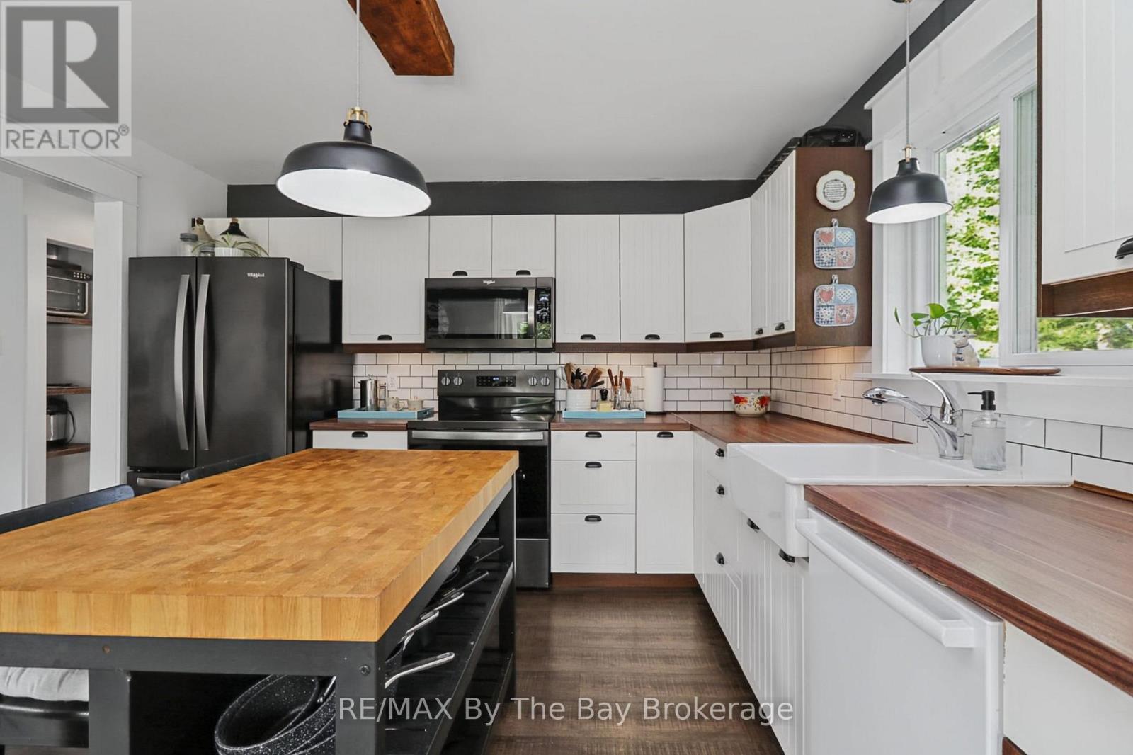 Kitchen Area with Black Stainless Appliances - 2 Red Oak Drive, Wasaga Beach, ON