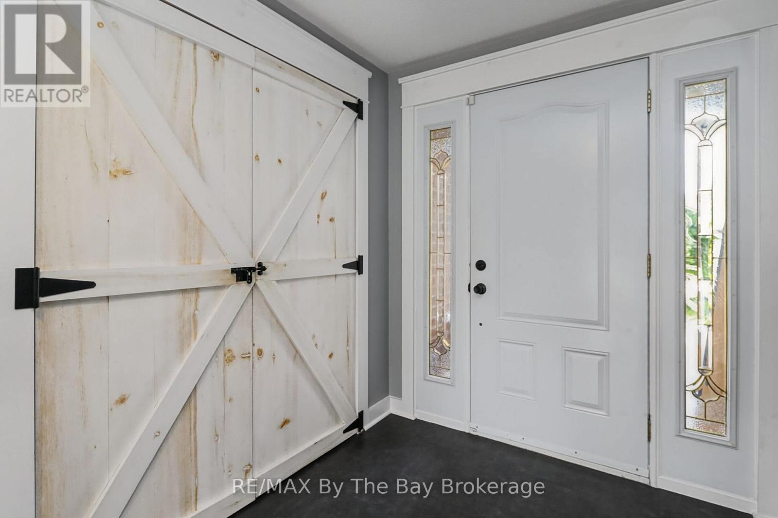 Foyer with Large Closet and Custom Barn Doors - 2 Red Oak Drive, Wasaga Beach, ON