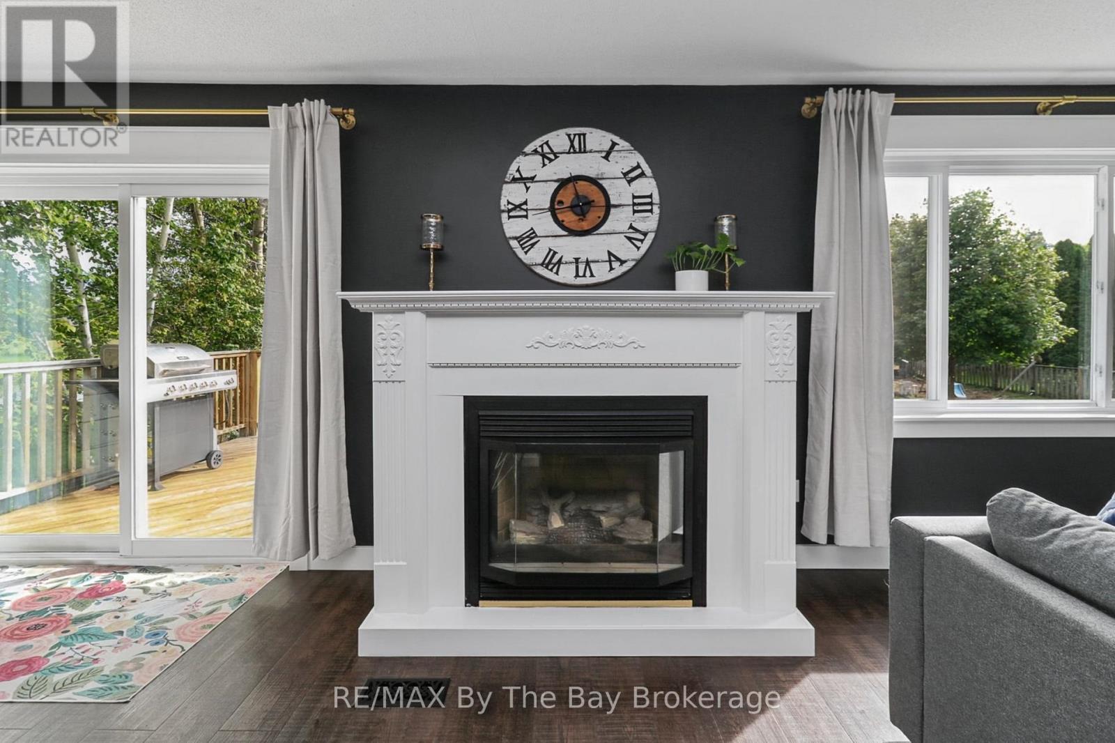 Gas Fireplace in a Custom Built Surround - 2 Red Oak Drive, Wasaga Beach, ON