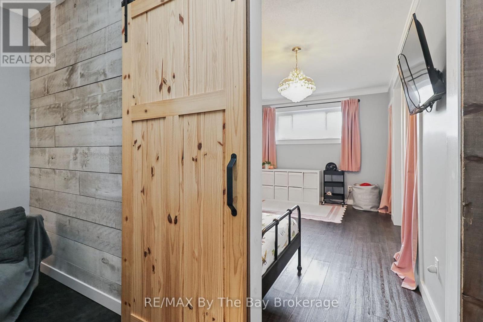 Feature Walls and Barn Doors to 2nd Bedroom - 2 Red Oak Drive, Wasaga Beach, ON