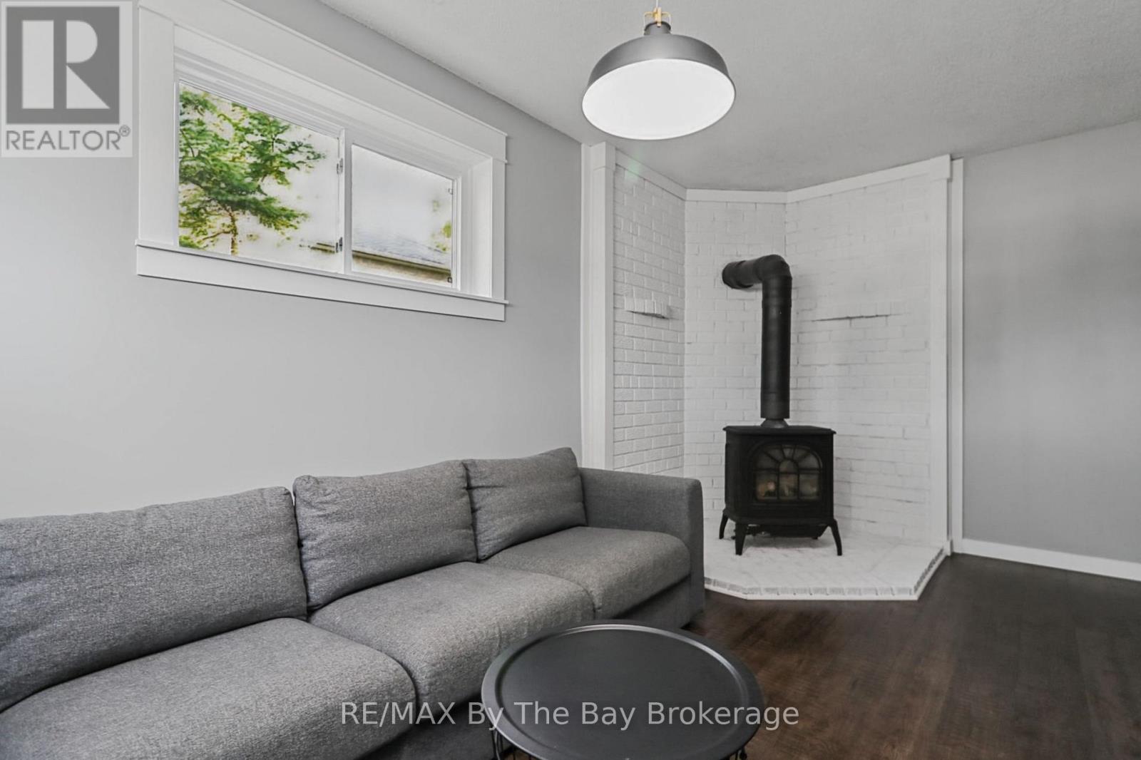 Gas Fireplace Feature in Rec Room - 2 Red Oak Drive, Wasaga Beach, ON