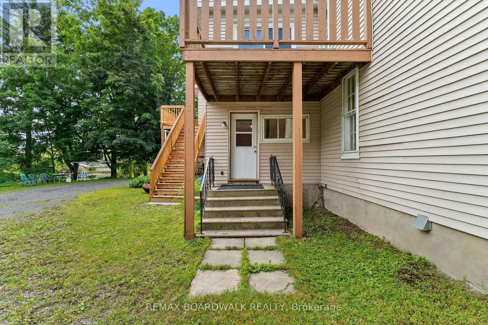 Back deck off the kitchen, great for the BBQ - 110-112-114 Clothier Street E, North Grenville, ON