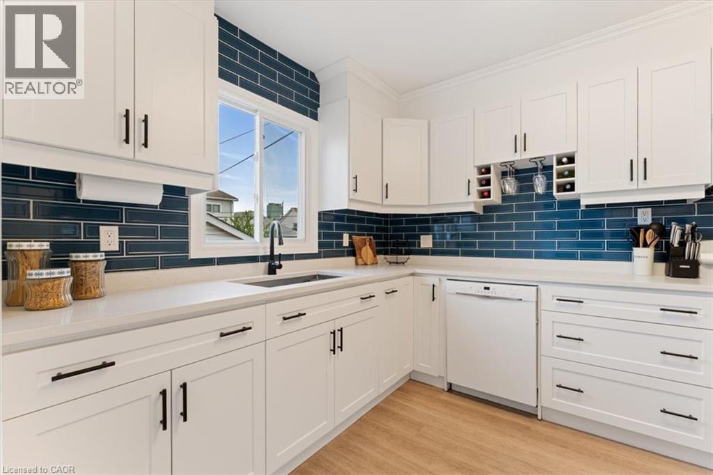 White shaker-style cabinetry with matte black hardware - 17 Craigmiller Avenue, Hamilton, ON