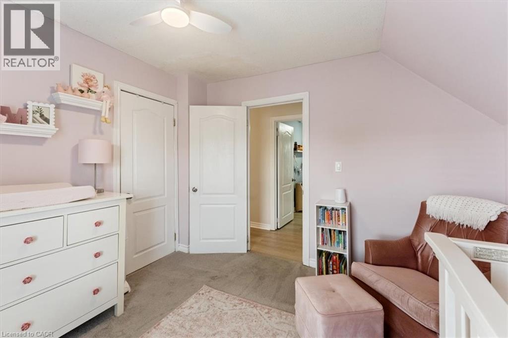 Room featuring carpet flooring and a ceiling fan - 17 Craigmiller Avenue, Hamilton, ON