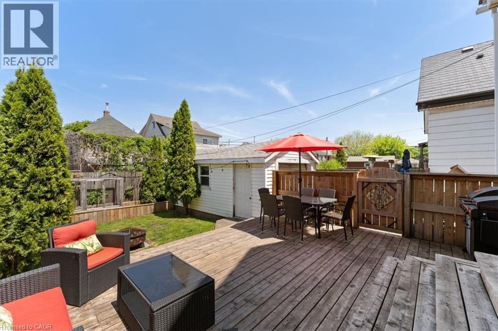 Spacious wood deck with multi-level design and direct access to a grassy yard - 17 Craigmiller Avenue, Hamilton, ON
