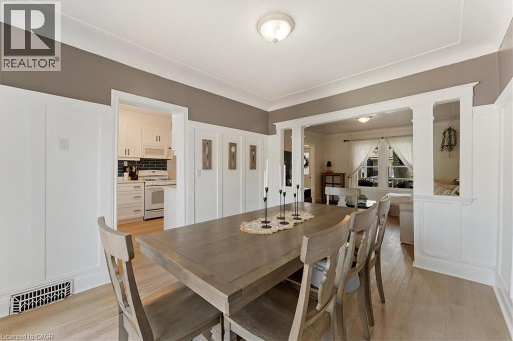 Dining area featuring light wood-finish flooring and a neutral color palette - 17 Craigmiller Avenue, Hamilton, ON