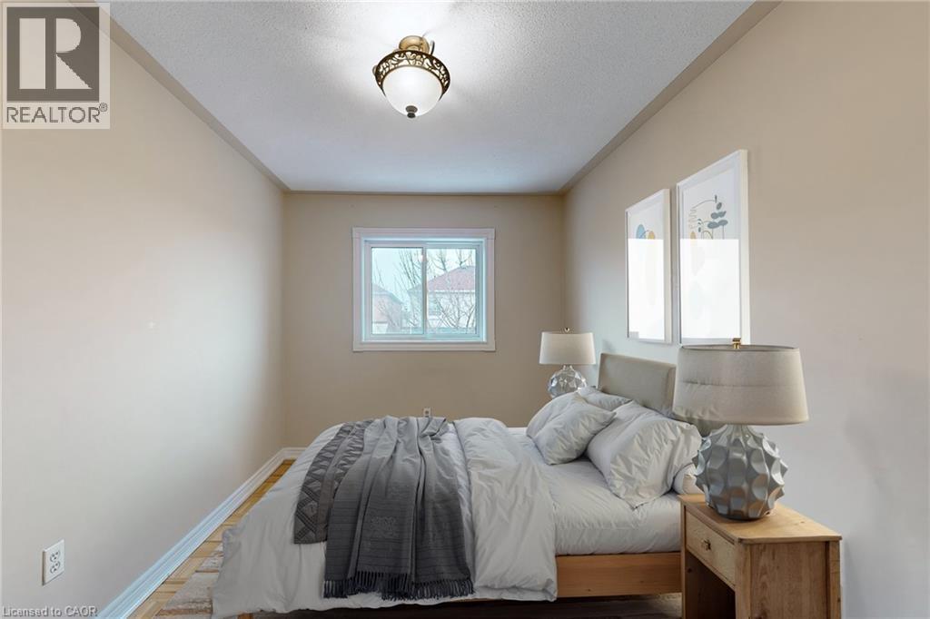 Recessed window with white trim, wood-finish flooring, and a ceiling-mounted light fixture - 21 Eastview Gate Unit# 36, Brampton, ON