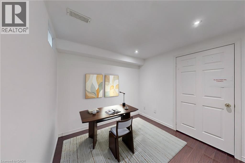 Recessed ceiling lighting, a narrow high-set window, and wood-finish flooring - 21 Eastview Gate Unit# 36, Brampton, ON