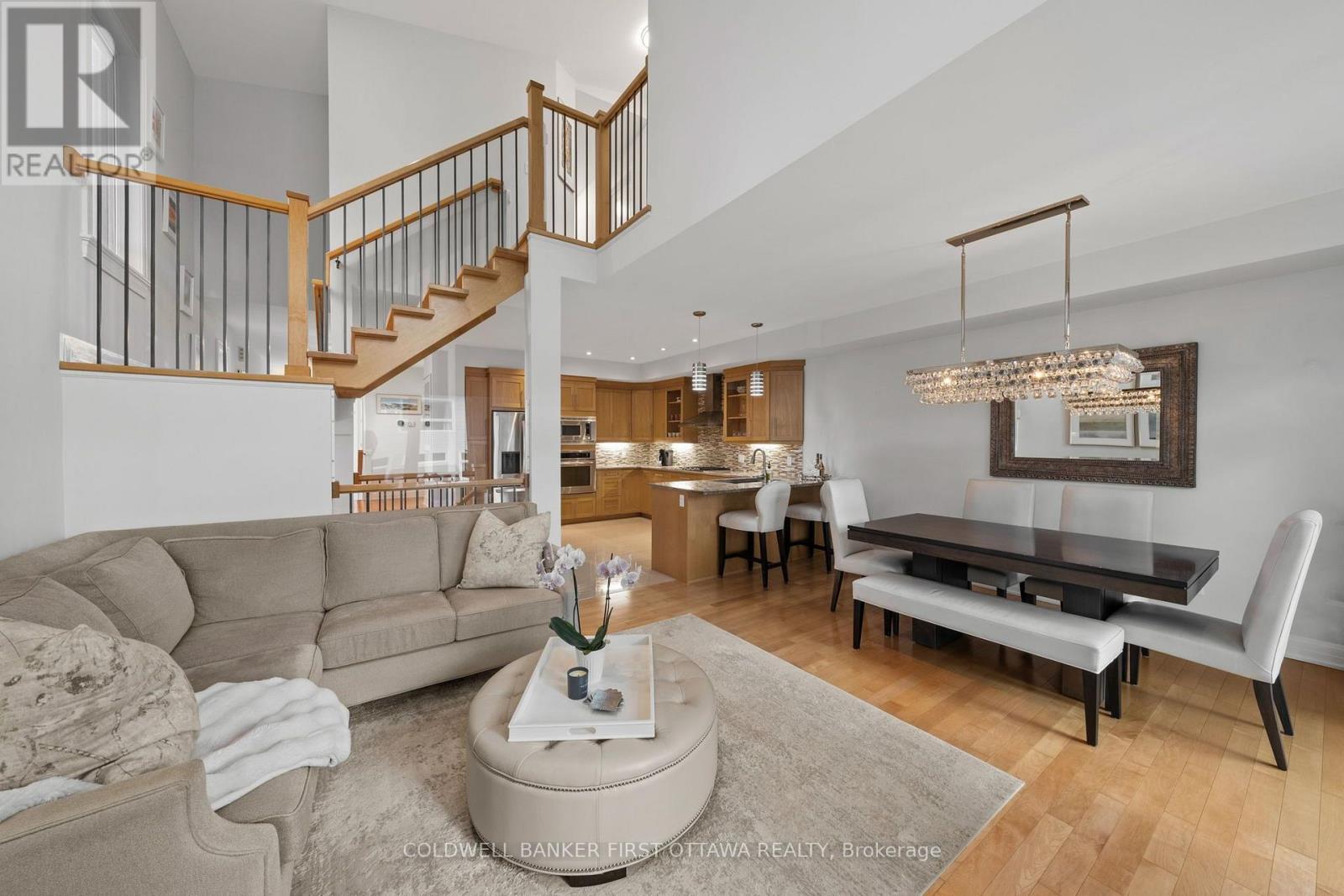 Natural hardwood flooring extends throughout home. - 155 Nora Street, Ottawa, ON